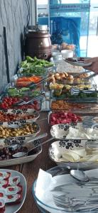 a buffet with many plates of food on a table at Otel DENİZYILDIZI CENTRUM in Fethiye +16 photos