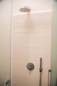 a bathroom door with a sink and a light at Trullo Fico d'India in Alberobello