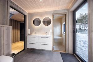 a bathroom with a sink and a mirror at Lakelodge 10p in Vradal +28 photos