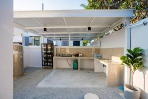 an open kitchen with a sink and a counter at Cloud Pool Villa Pattaya in Na Jomtien