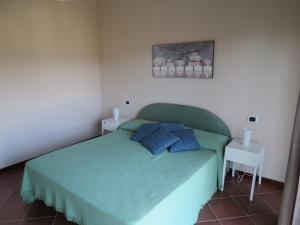 Una cama o camas en una habitación de Villetta in Tranquilla