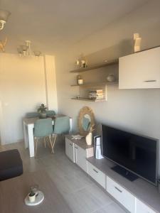 a living room with a large flat screen tv at El Rincón de Usgo in Miengo