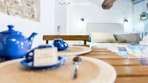 a kitchen with two sinks and a tea kettle on a table at Rio Alba Blue, Terre Marine in Riomaggiore