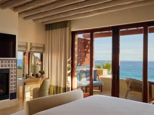 a bedroom with a view of the ocean at Waldorf Astoria Los Cabos Pedregal in Cabo San Lucas +136 photos