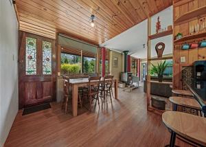 a dining room with a table and chairs in a house at Stonehaven in Freeburgh