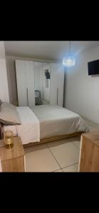 a bedroom with a large bed and a mirror at MaVi Apartament in Castel di Sangro +5 photos