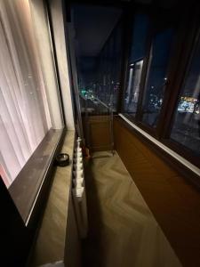 a room with a view of a city from a window at Korkyt in Qyzylorda