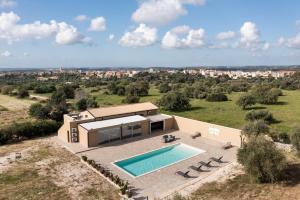 an aerial view of a house with a swimming pool at Villa Meti in Avola