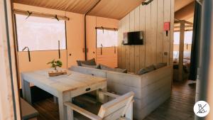 a room with a couch and a table in a room at Nice Camps - Lloret de Mar in Lloret de Mar
