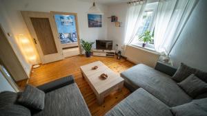 a living room with a couch and a coffee table at Ferienhaus-Saale-Unstrut in Wethau