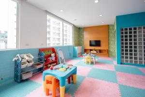 a childs room with a play area with a pretend at Shama Sukhumvit Bangkok in Bangkok