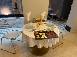 a table with a plate of food on it at Boutique Suites in Arcos de la Frontera +40 photos