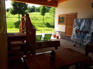 a view from the inside of a house with a porch at Chalupa Šalalandia in Zázrivá
