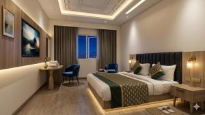 a hotel room with a bed and a table and chairs at The Shanti Plaza - Traveler's choice awarded 2025 - New Delhi Railway Station, Paharganj in New Delhi +44 photos