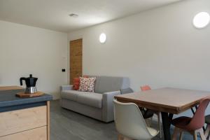 a living room with a couch and a table at Casa Bepa in Bormio