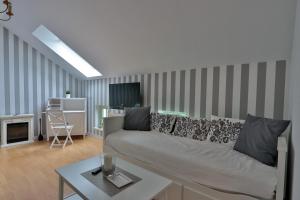 a living room with a couch and a table at Herrenhaus Blengow App.15 in Blengow