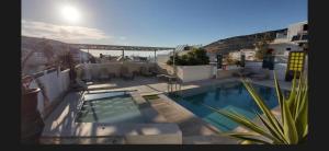 a view of a swimming pool on a building at Villa Dream in Matala