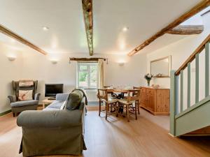 a living room with a couch and a table at 2 Bed in Llandovery oc-bn094 in Llandovery