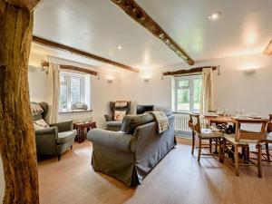a living room filled with furniture and a table at 2 Bed in Llandovery oc-bn094 in Llandovery