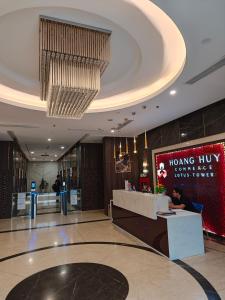 a lobby of a building with a sign on the wall at Chill House in Hai Phong +9 photos