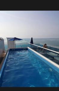 a swimming pool on the top of a building at Rainbow Residence Batumi in Batumi