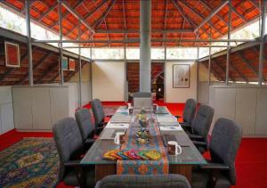 a large conference room with a long table and chairs at Amma Stays and Trails in Kotikulam
