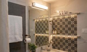 a bathroom with a shower and a sink at Amma Stays and Trails in Kotikulam +1 photo