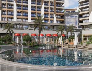 a large swimming pool in front of a building at Almaris Resort Hotel - Ultra All Inclusive in Alanya +59 photos