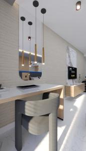 a kitchen with a table and a bench and chandelier at Almaris Resort Hotel - Ultra All Inclusive in Alanya