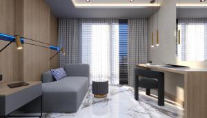 a living room with a couch and a desk at Almaris Resort Hotel - Ultra All Inclusive in Alanya