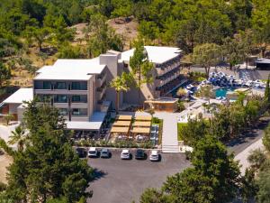 an aerial view of the resort with a parking lot at Cabú Hotel Adults Only - Small Luxury Hotels of the World in Faliraki