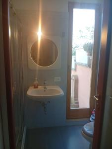 a bathroom with a sink and a window at Lillo Home in Isernia +28 photos