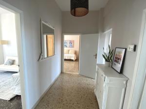 a hallway with a room with a bedroom and a mirror at Casa Carmen Vicchio, natura vicino a stazione e Mugello Circuit in Vicchio