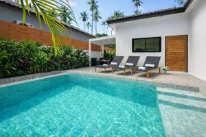 a swimming pool in the backyard of a house at Samui Kozy Private Pool Villa in Nathon Bay