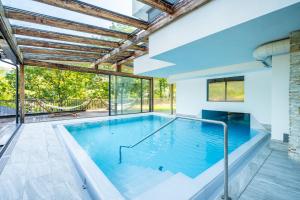 a swimming pool in the middle of a house at Hotel NockResort in Bad Kleinkirchheim +64 photos