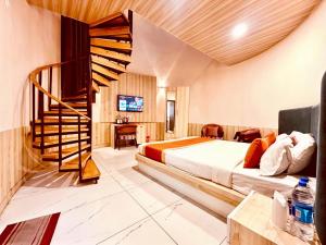 a hotel room with a bed and a staircase at The Pranav Retreat A Premium Property in Nainital