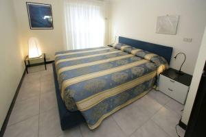 Ένα ή περισσότερα κρεβάτια σε δωμάτιο στο Savoia Apartments