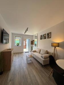 a living room with a couch and a table at Hostel Róża in Żywiec