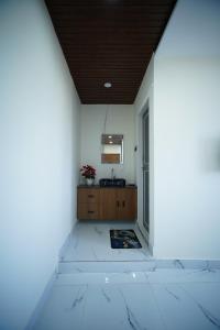 a bathroom with a sink and a mirror on a wall at sinhgad hills in Kharakvasla