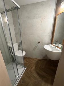 a bathroom with a toilet and a sink at Pałacyk Trzcińsko in Trzcińsko