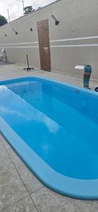 a large blue swimming pool on top of a building at Girassol & Estética in Macapá