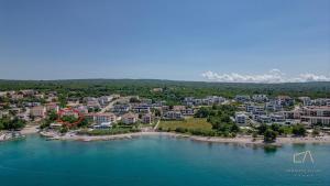 an aerial view of a resort on the water at Luxury Apartments Villa Luce in Malinska