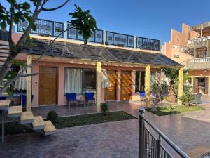 a house with a staircase leading to a patio at Riad Dar Salam in Agadir