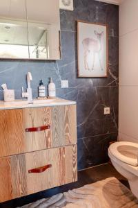 a bathroom with a sink and a toilet at Kemphaontje is a Magic Tiny House with a view in Anloo +32 photos