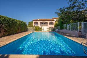 a swimming pool in front of a house at 6P apartment in a Citadelle with POOL - Saint-Tropez in Saint-Tropez