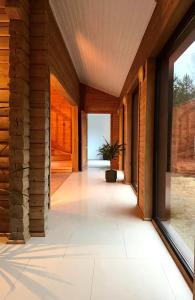 a hallway of a house with a potted plant at Silarozes in Mālpils