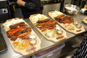 a buffet with several plates of food on a counter at White Rose Hotel & Restaurant - Leeds in Leeds +63 photos
