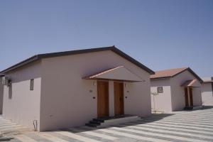 a rendering of a house in a subdivision at Palm Glow Resort in Daisara +7 photos