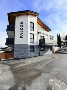 a building with the name on the side of it at Falcon Suites Pure - Summercard included in Kaprun