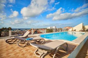 a swimming pool on the roof of a building at Patio Antigo Residence in Santa Maria